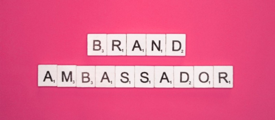 brand-ambassador-scrabble-letters-word-on-a-pink-b-2023-11-27-05-31-00-utc-1