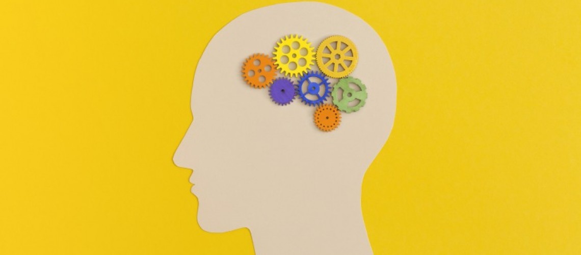 human-head-with-gears-on-yellow-background-2023-11-27-05-21-37-utc-1