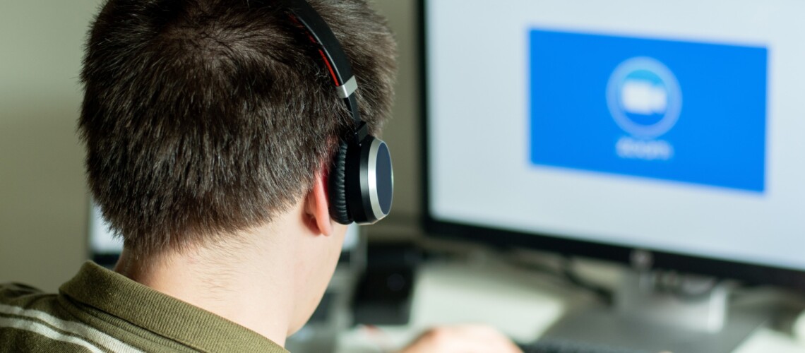 man-with-headphones-looking-on-the-monitor-with-zo-2022-11-15-14-04-04-utc-1